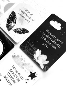 Vauvan vuosi cards contains 39 illustrated cards and one instruction card to help you save your baby's first year, the main events fair, captured memories. Black and White.