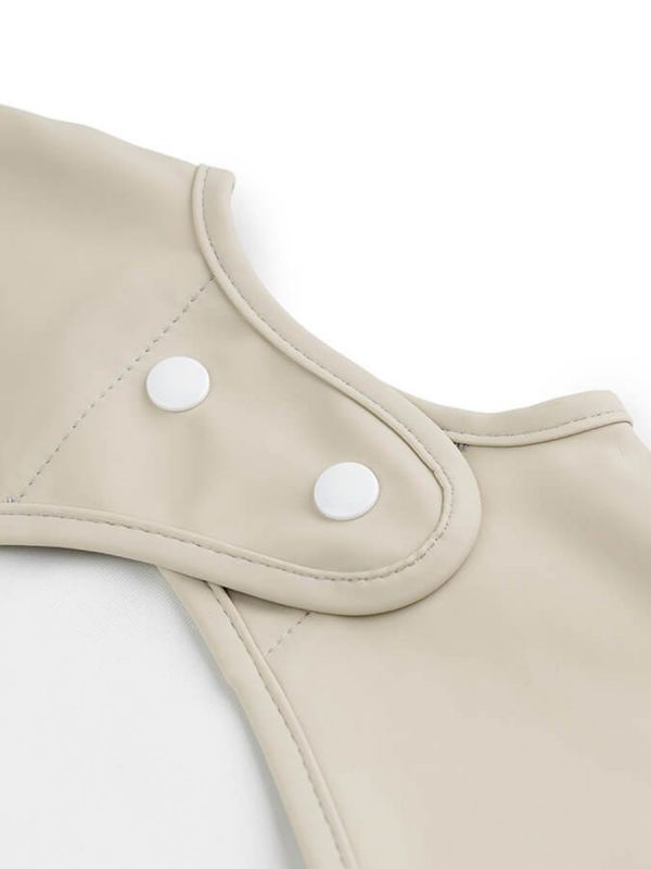 Longsleeve bib from Done by Deer PVC-free coated polyester - durable and practical material.