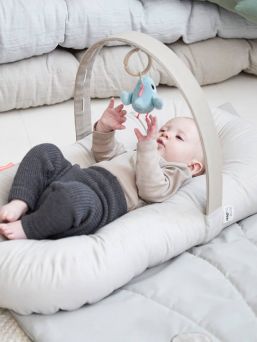 Done by Deer Play Mat / Sleeping Nest Cozy Lounger. The play mat can be used as a sleeping nest as well as during the tummy time, when the head lifting exercises start with the baby.