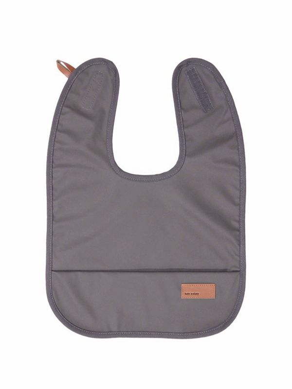 Baby Wallaby's stylish dark grey bib for baby. The bib is waterproof and soft. It is easy to wipe the food stains and it is wonderfully soft, so you can easily put it to your diaper bag. Bib is easy to attach with a velcro strap.