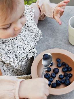 Desert Rain Bib from Elodie Details PVC-free coated polyester - durable and practical material.