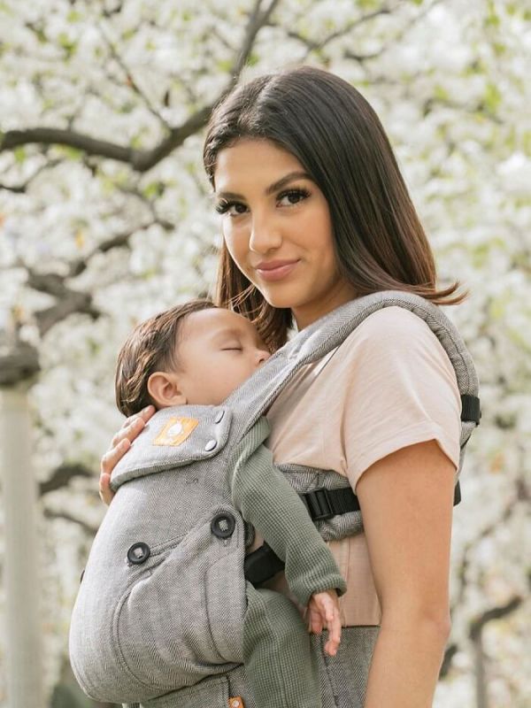 TULA Explore Baby Carrier. Multiple positions to carry baby including front facing out, facing in, and back carry. Each position provides a natural, ergonomic position.