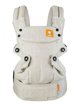 TULA Explore Baby Carrier sand. Multiple positions to carry baby including front facing out, facing in, and back carry. Each position provides a natural, ergonomic position.