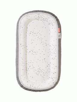 A soft and secure Done By Deer Dreamy dots  babynest gives your baby a peaceful sleep. The babynest increases the sense of security by reducing the baby's sleeping space.