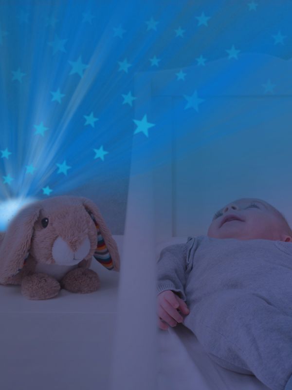 Zazu rabbit Ruby nightlight turns your child's room into a magical starry sky while playing soothing melodies.