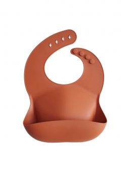 Mushie silicone bib is classic and timeless. Easy to clean and you can roll it along the way.