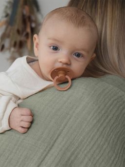 BIBS Muslin cloth is premium GOTS certified multifunctional baby cloth that can be used as a burp cloth, nursing cover, a cover on your changing mat, or as a bib.