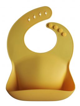 Mushie silicone bib is classic and timeless. Easy to clean and you can roll it along the way.