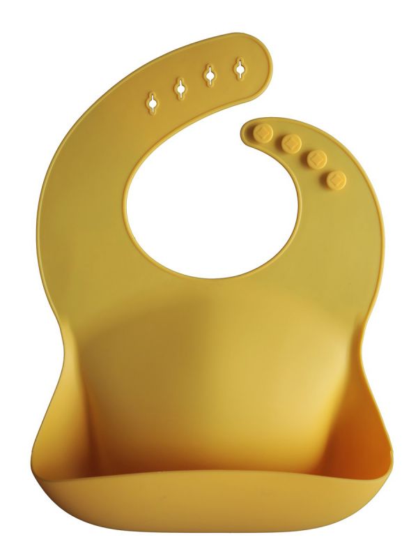 Mushie silicone bib is classic and timeless. Easy to clean and you can roll it along the way.