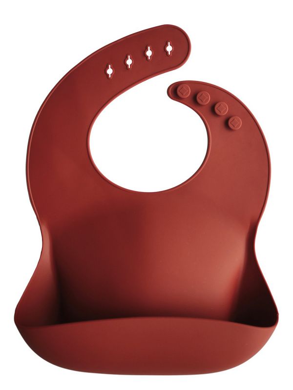 Mushie silicone bib is classic and timeless. Easy to clean and you can roll it along the way.