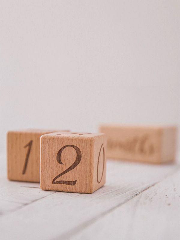 Wooden age blocks for baby photography. The blocks tell in the photo the child's age in delightful way.