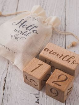 Wooden age blocks for baby photography. The blocks tell in the photo the child's age in delightful way.