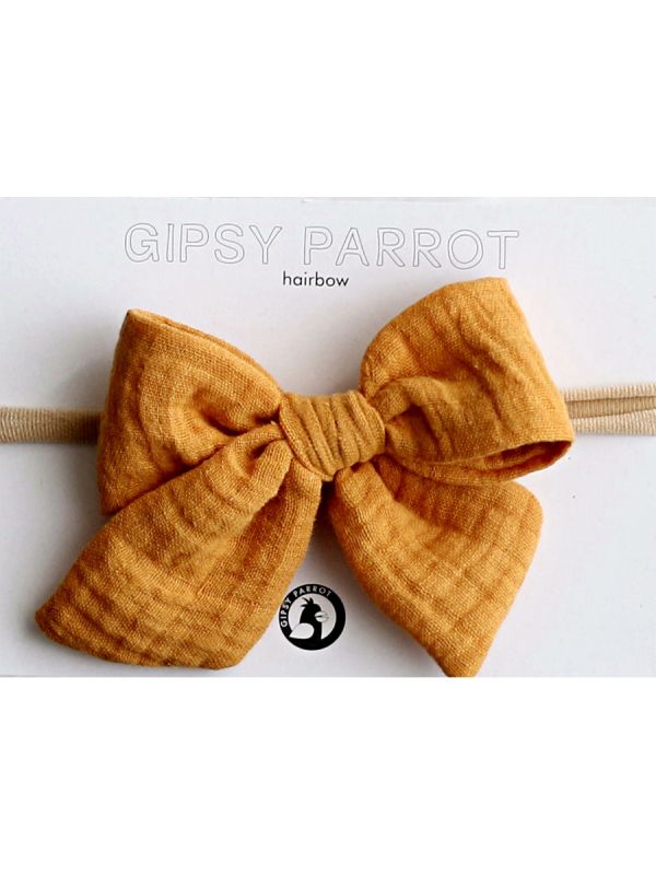 Beautiful and adorable Gipsyparrot Muslin collection bow headwrap for baby. All bow headwraps are made by hand. The fabrics are soft and the headband does not tighten or squeeze the baby's head.