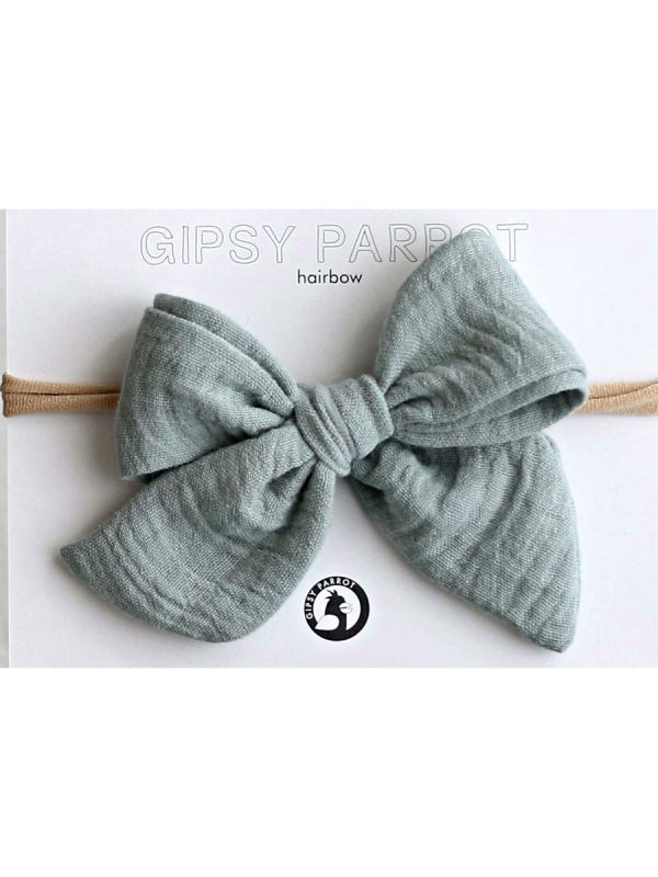 Beautiful and adorable Gipsyparrot Muslin collection bow headwrap for baby. All bow headwraps are made by hand. The fabrics are soft and the headband does not tighten or squeeze the baby's head.