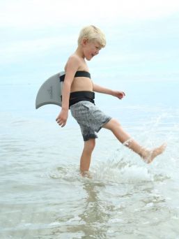 The Swimfin Shark Fin for Children learning to swim, a safety swimming aid and flotation device.