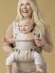 TULA Explore Baby Carrier sand. Multiple positions to carry baby including front facing out, facing in, and back carry. Each position provides a natural, ergonomic position.