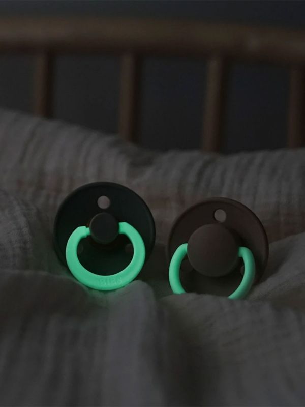 BIBS pacifier is a real classic!  The dummy with the traditional round shield and the cherry-shaped dummy part has been comforting Danish infants for nearly 50 years. The night pacifiers loop shines in the dark. 2-pack.