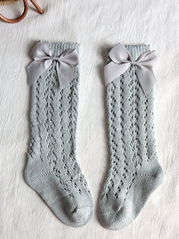 Beautiful baby cotton sock with a wonderful lace pattern and bow.