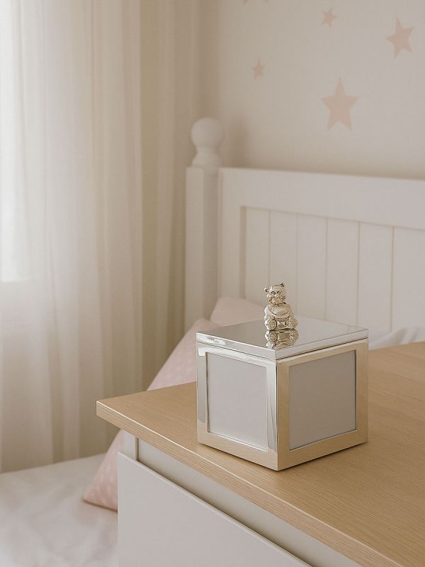 A beautiful silver-plated music box, bear