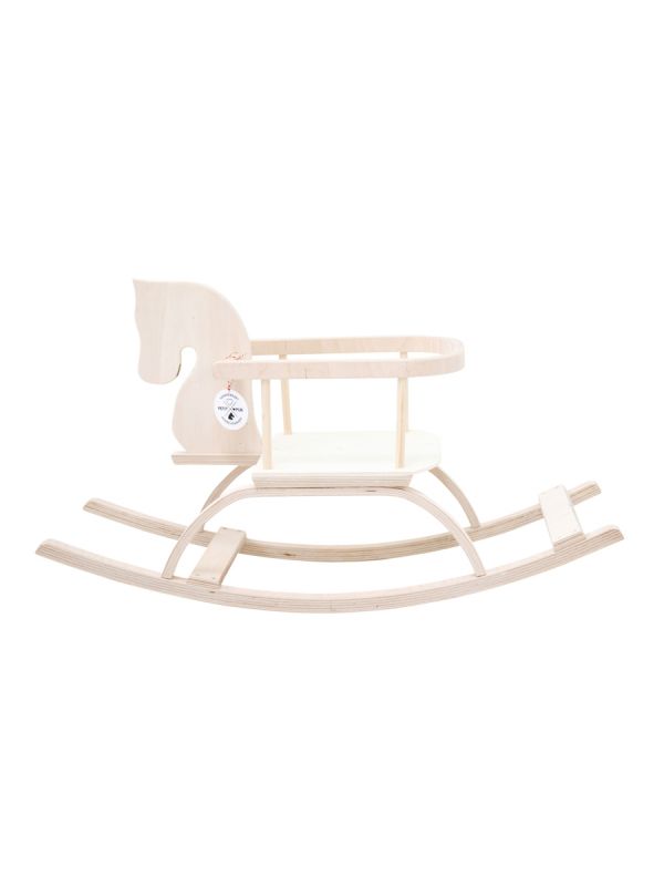 Handmade white rocking horse in the kid's room.