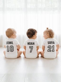 Jersey shortsleeve body with the child's own name and number, white